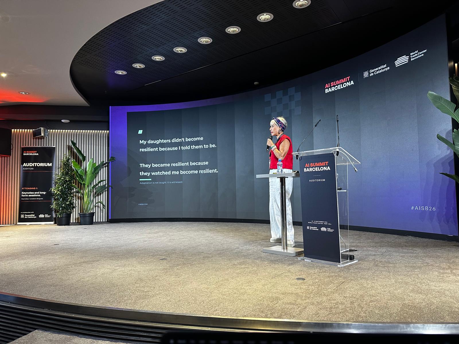 Myriam Ben Farhat on the AI Summit Barcelona stage with a quote about resilience on screen