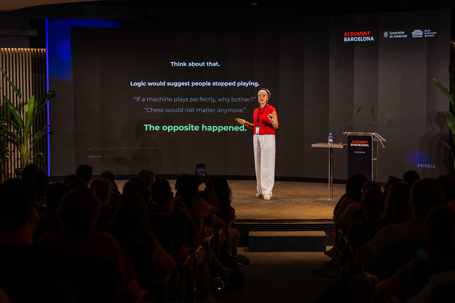 Myriam Ben Farhat keynoting at AI Summit Barcelona 2026 in front of a chess slide